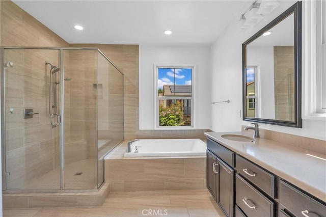 65 Rexford, Irvine, CA 92620 - bathroom featuring vanity, a garden tub, a shower stall, recessed lighting, and tile patterned floors