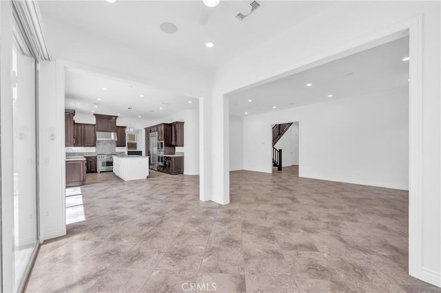 65 Rexford, Irvine, CA 92620 - unfurnished living room featuring ceiling fan and recessed lighting