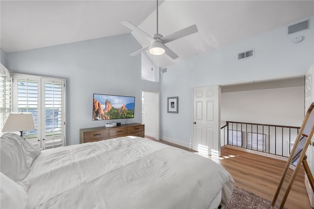 747 Highland View Dr, Corona, CA 92882 - bedroom with high vaulted ceiling, wood finished floors, access to exterior, and ceiling fan