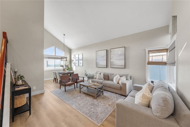747 Highland View Dr, Corona, CA 92882 - living room featuring high vaulted ceiling and light wood finished floors