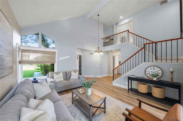 747 Highland View Dr, Corona, CA 92882 - living area with stairs, wood finished floors, beamed ceiling, high vaulted ceiling, and a chandelier