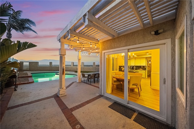 747 Highland View Dr, Corona, CA 92882 - patio terrace at dusk with a pergola, outdoor dining space, and a patio