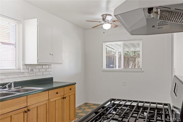 38953 Foxholm Dr, Palmdale, CA 93551 - kitchen featuring range hood, healthy amount of natural light, a ceiling fan, and dark countertops