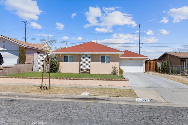 38953 Foxholm Dr, Palmdale, CA 93551 - single story home with concrete driveway, stucco siding, and a garage