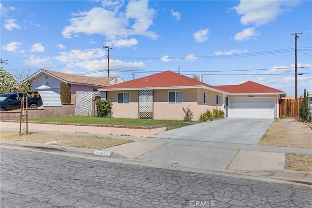 38953 Foxholm Dr, Palmdale, CA 93551 - ranch-style house featuring concrete driveway, a garage, and stucco siding