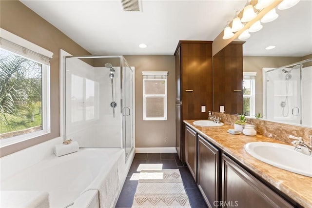 23004 Seattle Ridge Rd, Wildomar, CA 92595 - bathroom with a shower stall, a bath, double vanity, tile patterned flooring, and recessed lighting