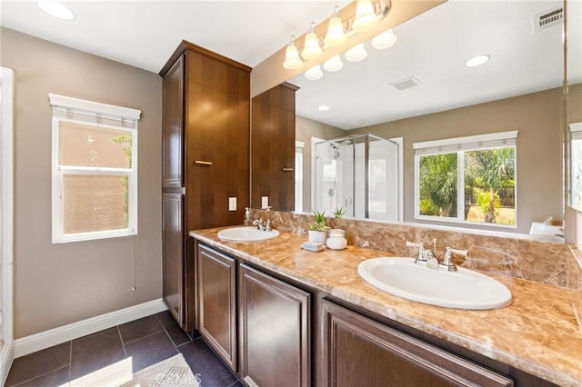 23004 Seattle Ridge Rd, Wildomar, CA 92595 - full bath featuring a shower stall, double vanity, and tile patterned floors