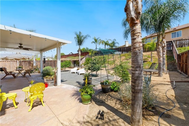 23004 Seattle Ridge Rd, Wildomar, CA 92595 - fenced backyard featuring a ceiling fan and a patio area