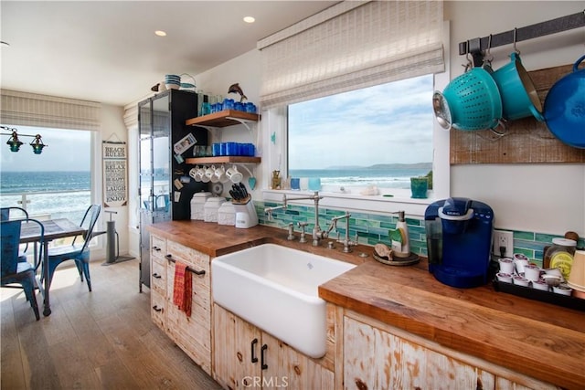 3436 Studio Dr, Cayucos, CA 93430 - kitchen with wood counters, light brown cabinets, wood finished floors, recessed lighting, and a water view