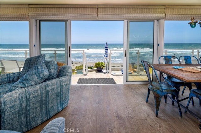 3436 Studio Dr, Cayucos, CA 93430 - dining area featuring wood finished floors and view of water and beach