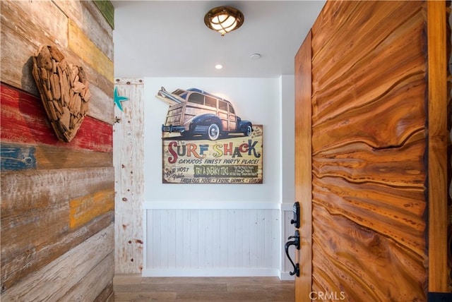 3436 Studio Dr, Cayucos, CA 93430 - hallway featuring wood finished floors, a wainscoted wall, and wooden walls