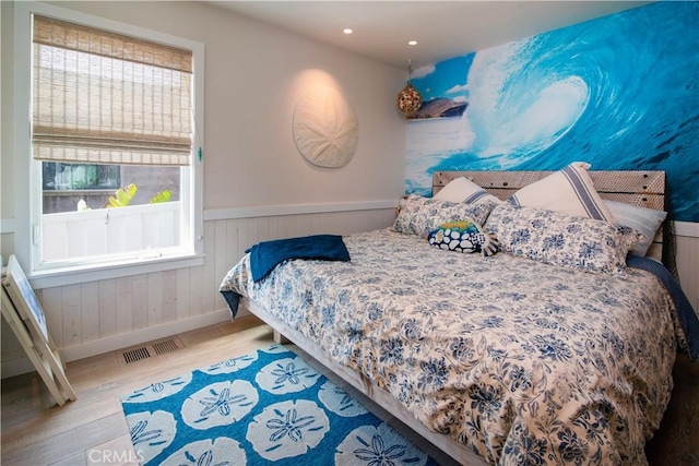 3436 Studio Dr, Cayucos, CA 93430 - bedroom featuring wood finished floors, wainscoting, and recessed lighting