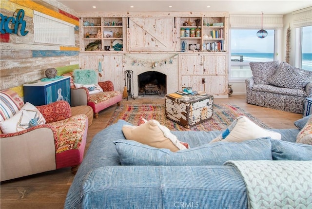 3436 Studio Dr, Cayucos, CA 93430 - living room with wood finished floors, a fireplace, and recessed lighting