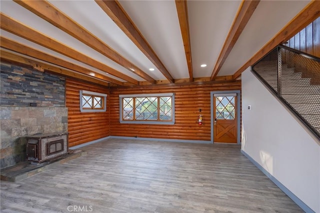 1025 W Big Bear Blvd, Big Bear City, CA 92314 - unfurnished living room featuring a wood stove, wood finished floors, beam ceiling, and recessed lighting