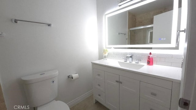 22127 Halsted St, Chatsworth, CA 91311 - bathroom featuring vanity, a shower with door, and decorative backsplash