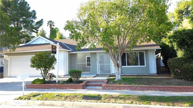 22127 Halsted St, Chatsworth, CA 91311 - ranch-style house featuring a garage
