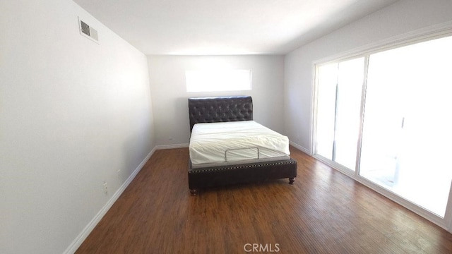 22127 Halsted St, Chatsworth, CA 91311 - bedroom featuring wood finished floors and baseboards