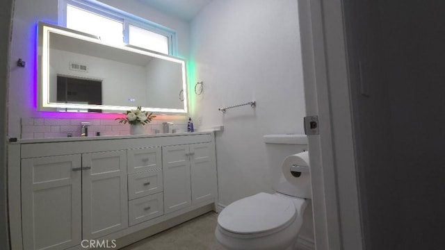 22127 Halsted St, Chatsworth, CA 91311 - bathroom with tasteful backsplash, double vanity, and tile patterned flooring