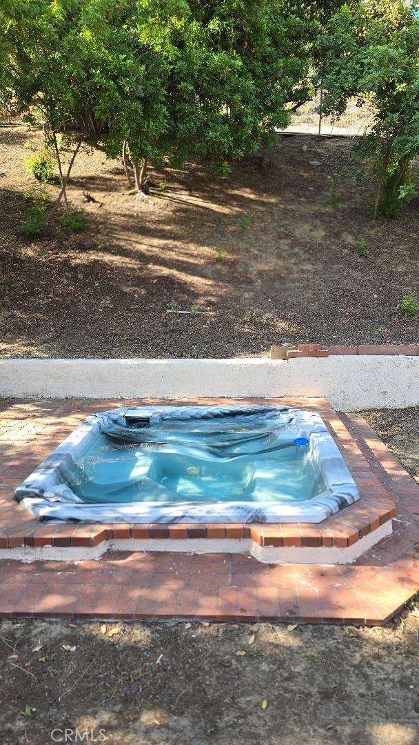 22127 Halsted St, Chatsworth, CA 91311 - view of swimming pool with a jacuzzi