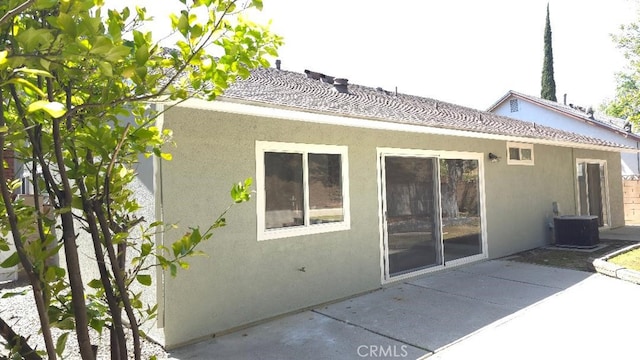 22127 Halsted St, Chatsworth, CA 91311 - rear view of house with stucco siding and a patio area