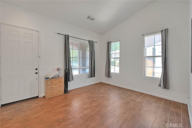 1503 Lynwood Way, Highland, CA 92346 - empty room with vaulted ceiling and light wood-style floors