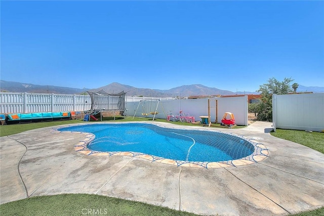 1503 Lynwood Way, Highland, CA 92346 - view of pool with a trampoline, a fenced backyard, and a patio