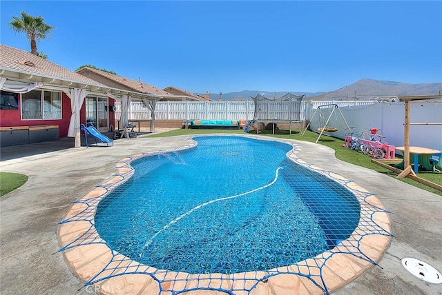 1503 Lynwood Way, Highland, CA 92346 - view of pool with a fenced backyard, a patio, and a mountain view