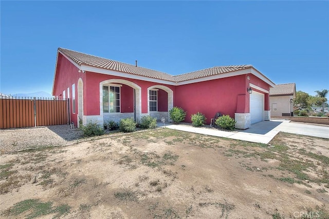 1503 Lynwood Way, Highland, CA 92346 - single story home featuring a garage, stucco siding, stone siding, concrete driveway, and a tiled roof