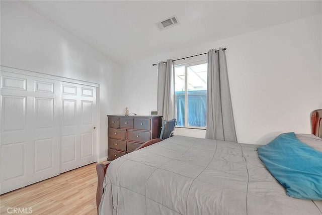 1503 Lynwood Way, Highland, CA 92346 - bedroom with lofted ceiling, wood finished floors, and a closet