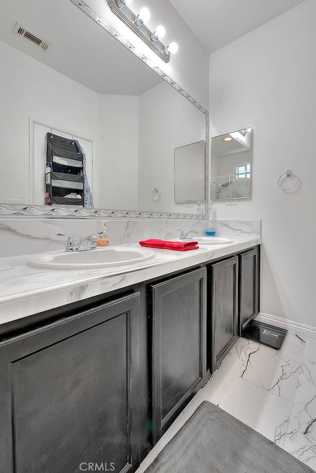 1503 Lynwood Way, Highland, CA 92346 - bathroom with double vanity and marble look tile flooring