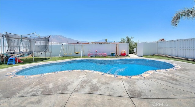 1503 Lynwood Way, Highland, CA 92346 - view of swimming pool featuring a trampoline, a patio area, and a fenced backyard