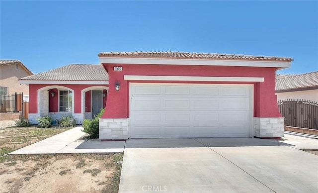 1503 Lynwood Way, Highland, CA 92346 - view of front of home featuring stone siding, driveway, a garage, a tile roof, and stucco siding