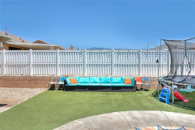1503 Lynwood Way, Highland, CA 92346 - view of yard featuring a trampoline and an outdoor living space
