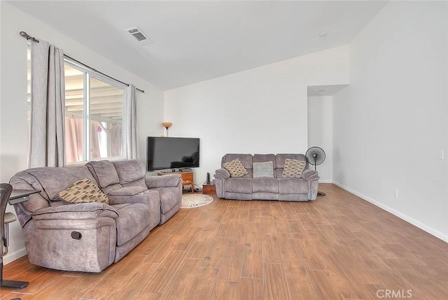 1503 Lynwood Way, Highland, CA 92346 - living area featuring vaulted ceiling and wood finished floors