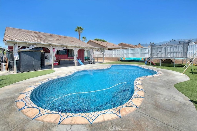 1503 Lynwood Way, Highland, CA 92346 - view of pool with a trampoline, a patio, an outdoor living space, a fenced backyard, and a gazebo