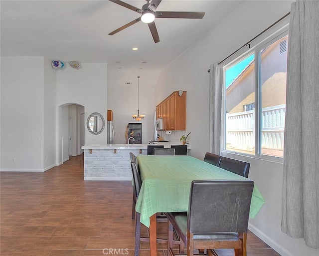 1503 Lynwood Way, Highland, CA 92346 - dining room with a ceiling fan, arched walkways, plenty of natural light, dark wood finished floors, and recessed lighting