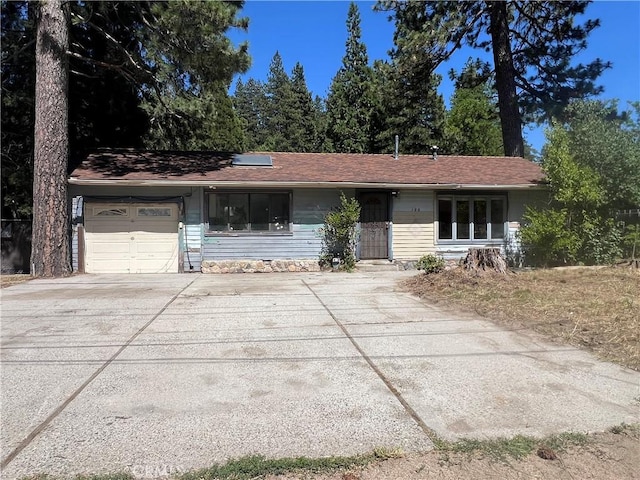 196 Meadow Ln, Crestline, CA 92322 - ranch-style home featuring concrete driveway and a garage