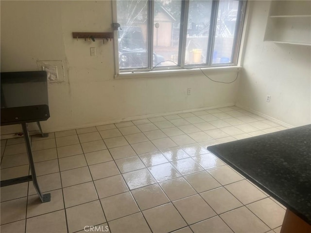 196 Meadow Ln, Crestline, CA 92322 - unfurnished dining area featuring light tile patterned floors and baseboards