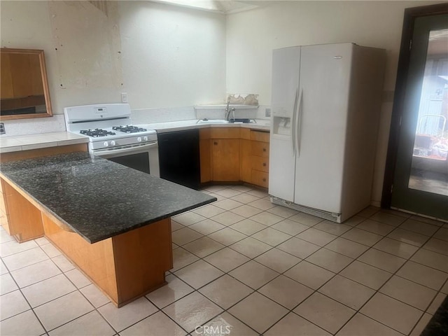 196 Meadow Ln, Crestline, CA 92322 - kitchen featuring white appliances, a peninsula, light tile patterned flooring, and a breakfast bar area