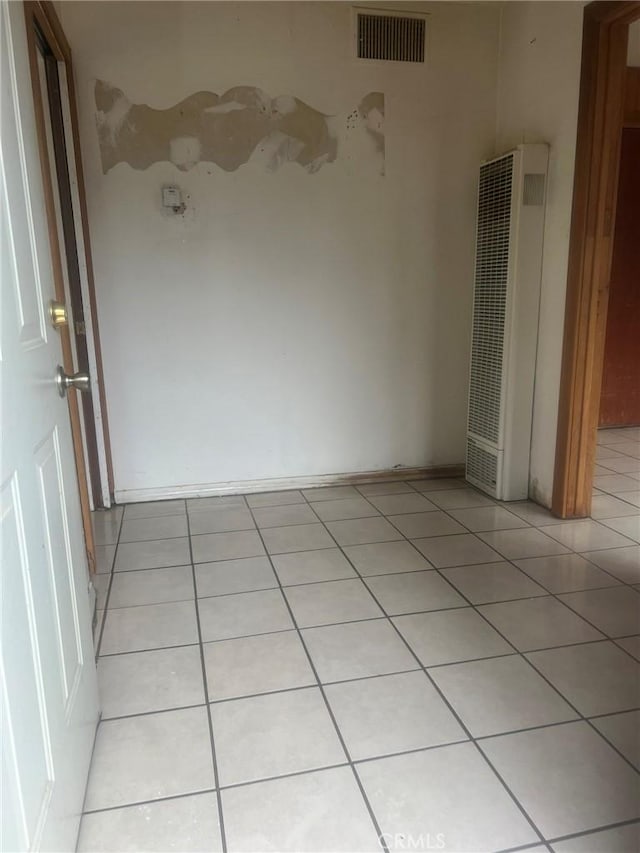 196 Meadow Ln, Crestline, CA 92322 - unfurnished room featuring a heating unit and light tile patterned floors