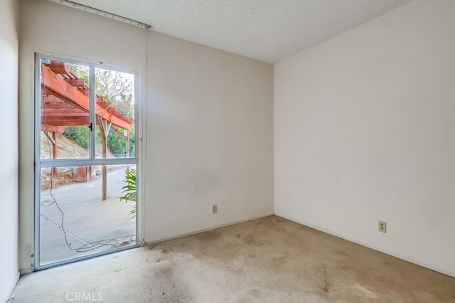 27909 Alaflora Dr, Rancho Palos Verdes, CA 90275 - empty room with light colored carpet and a textured ceiling