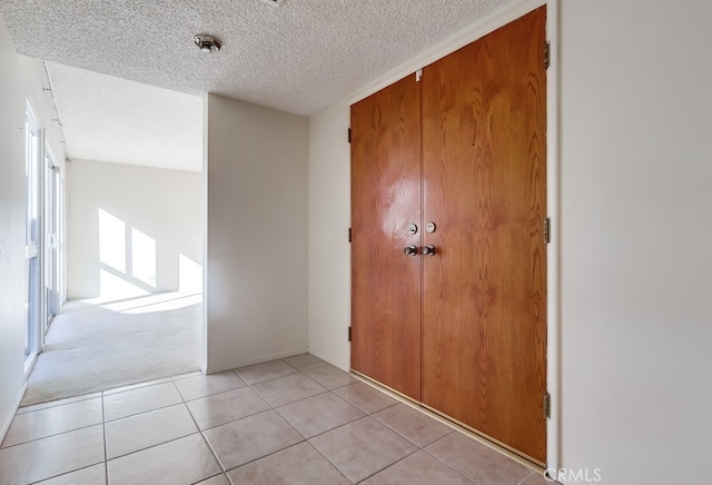 27909 Alaflora Dr, Rancho Palos Verdes, CA 90275 - foyer entrance featuring a textured ceiling and light tile patterned floors