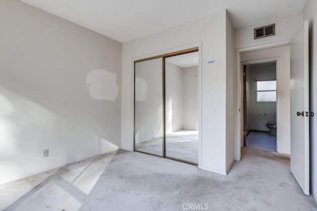 27909 Alaflora Dr, Rancho Palos Verdes, CA 90275 - unfurnished bedroom with light colored carpet, a closet, and a textured ceiling