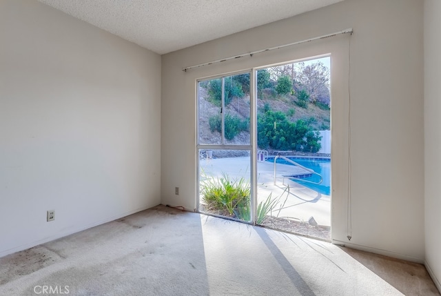 27909 Alaflora Dr, Rancho Palos Verdes, CA 90275 - spare room featuring light colored carpet and a textured ceiling