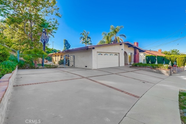 27909 Alaflora Dr, Rancho Palos Verdes, CA 90275 - ranch-style house with stucco siding, an attached garage, concrete driveway, and a chimney
