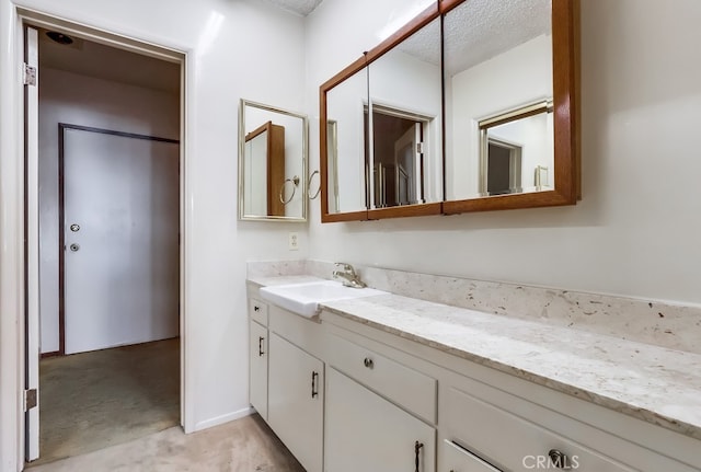 27909 Alaflora Dr, Rancho Palos Verdes, CA 90275 - bathroom with vanity and a textured ceiling
