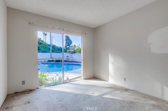 27909 Alaflora Dr, Rancho Palos Verdes, CA 90275 - empty room featuring carpet and a textured ceiling
