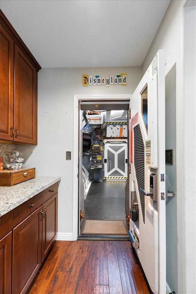 22517 Skipping Stone Dr, Saugus, CA 91350 - kitchen featuring dark wood finished floors and light stone counters