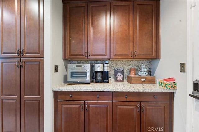 22517 Skipping Stone Dr, Saugus, CA 91350 - kitchen with backsplash and light stone counters