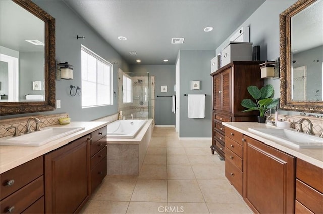 22517 Skipping Stone Dr, Saugus, CA 91350 - bathroom featuring a shower stall, two vanities, a bath, and tile patterned flooring